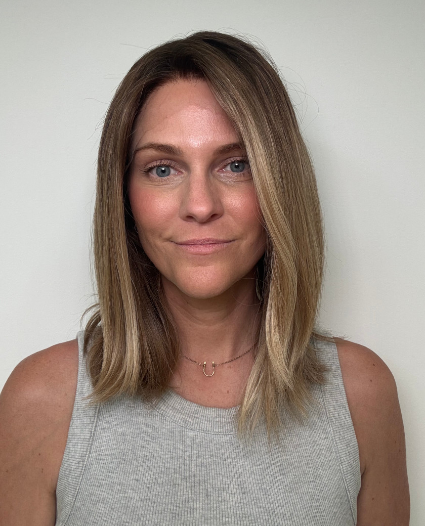Carrie — Warm brunette with soft, natural-looking blonde highlights. Dark rooted with seamless brightness through the mid-lengths and ends.