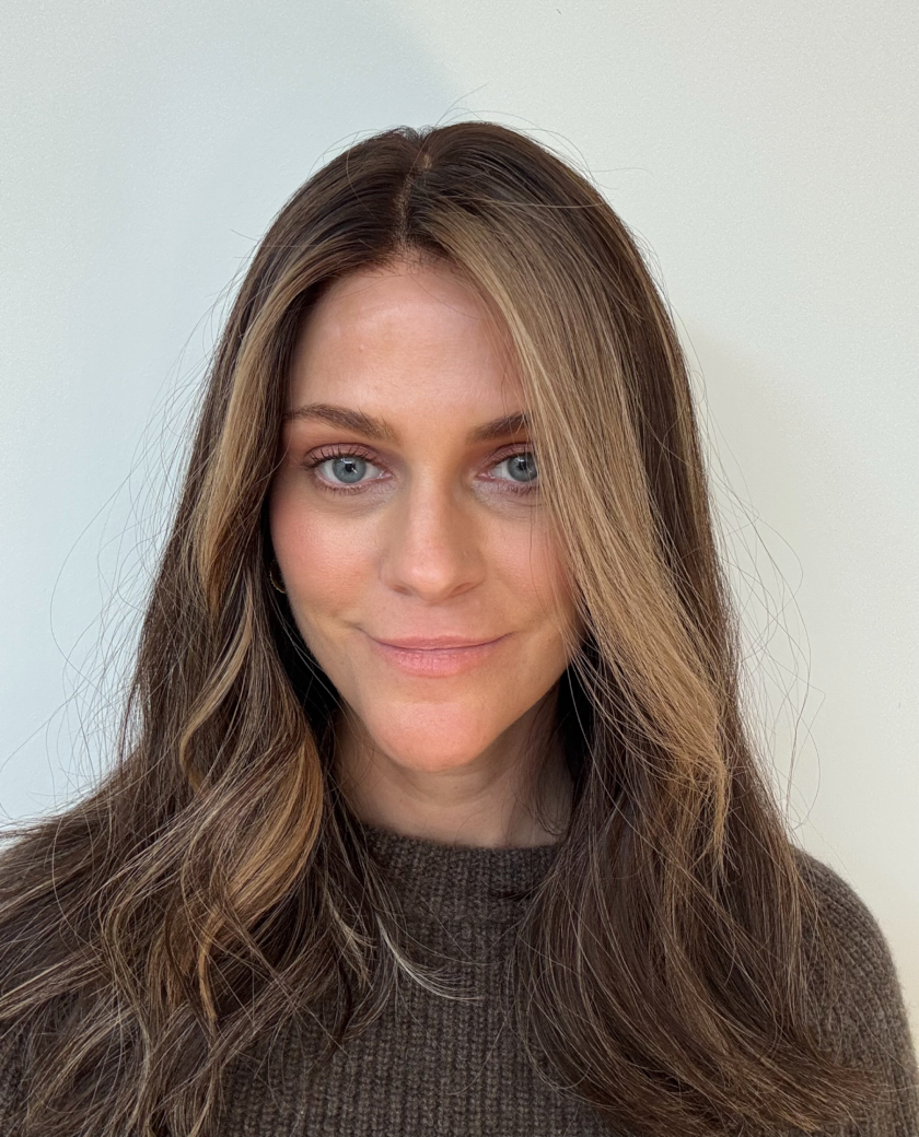 Joni — Dark brown base with subtle cooler tones. Cooler baby highlights throughout with a blonde money piece.