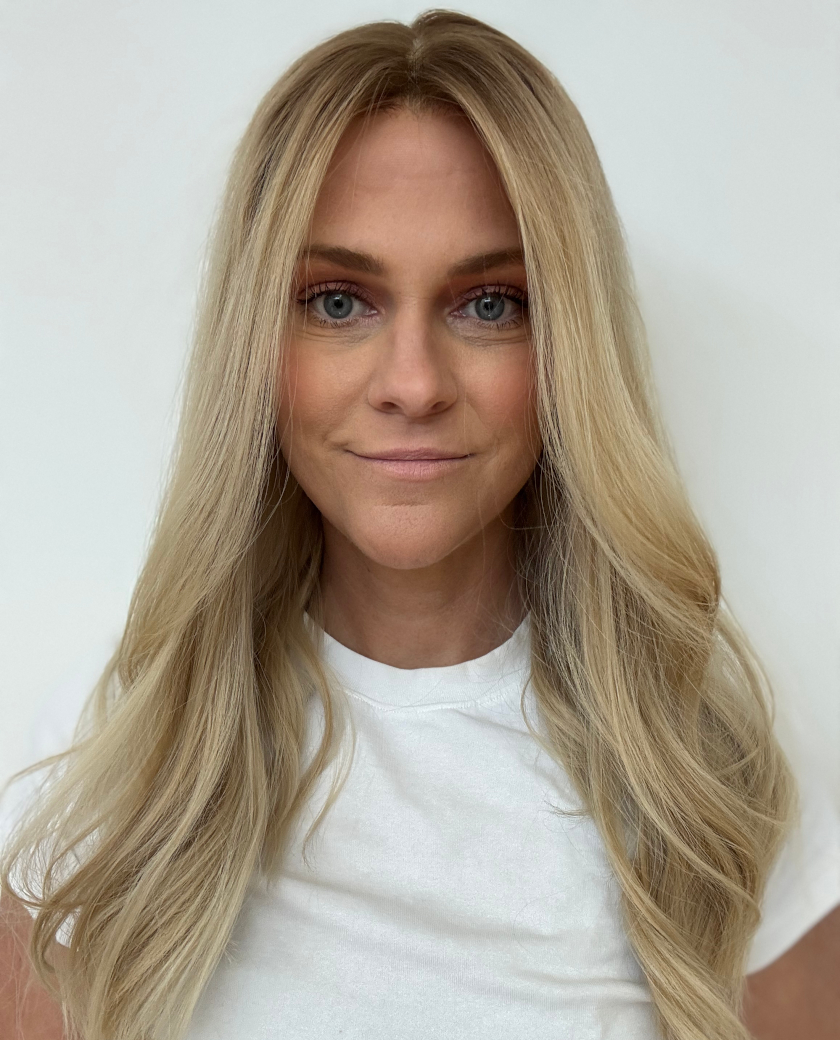 Nicole — Rooted neutral beige blonde with soft golden dimension.